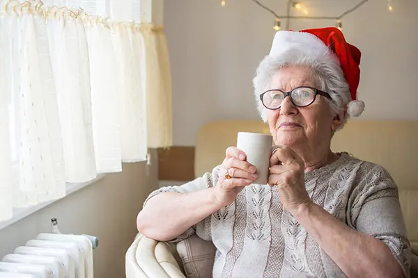Senior woman wearing santa hat