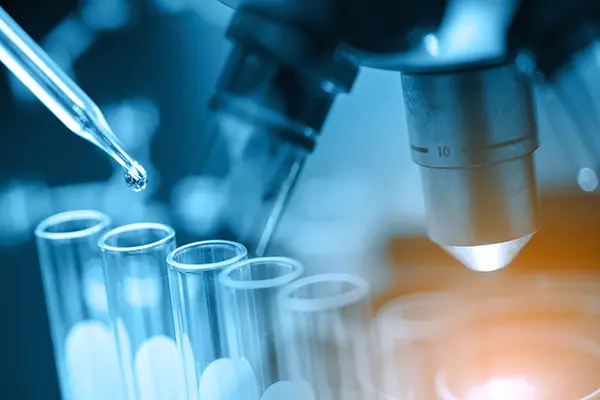 microscope with lab glassware, science laboratory research and development