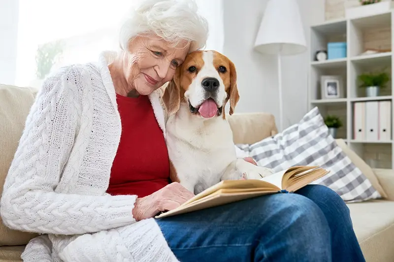 happy senior woman with dog
